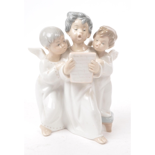 65 - Lladro - Two hand made Spanish porcelain cherubs figurines. Including an angelic trio choir and sing... 