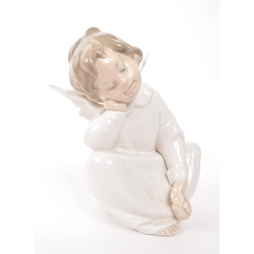 65 - Lladro - Two hand made Spanish porcelain cherubs figurines. Including an angelic trio choir and sing... 