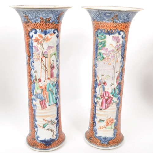 69 - A pair of Chinese export Mandarin Palette baluster vases with covers. Hand painted in blue and orang... 