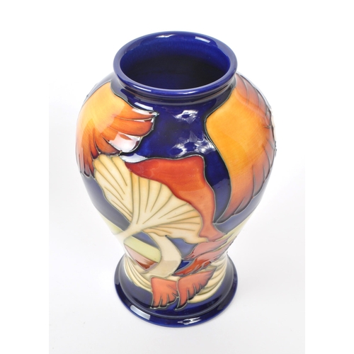 72 - Moorcroft - A modern ceramic vase designed by Kerry Goodwin in the Parasol dance design, 2005, signa... 