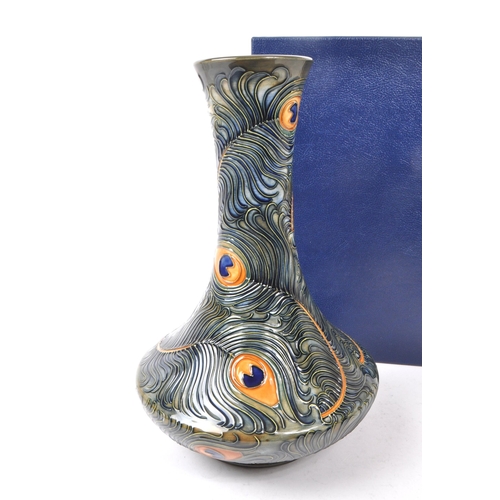 76 - Moorcroft Pottery - Late 20th century circa 1996 ceramic peacock / phoenix feather vase. Hand made i... 