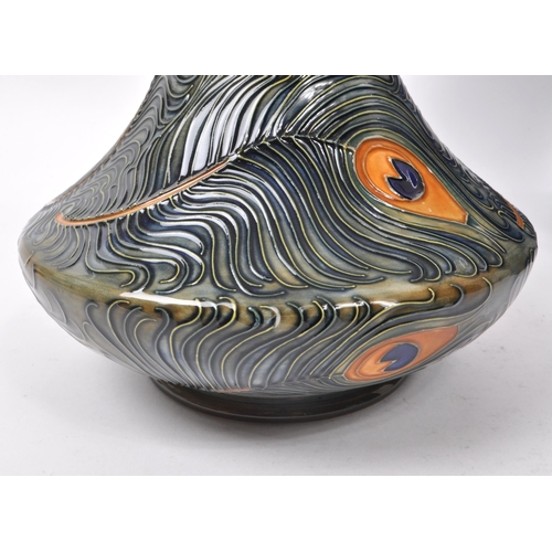 76 - Moorcroft Pottery - Late 20th century circa 1996 ceramic peacock / phoenix feather vase. Hand made i... 