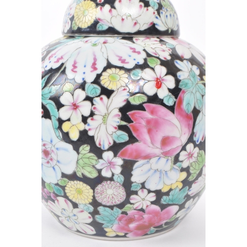 77 - An early 20th century Nianqian Zhilong ginger jar. Hand painted with floral pattern agains a black g... 