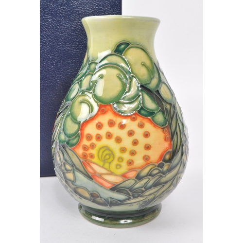 79 - Sally Tuffin for Moorcroft - A squat baluster vase decorated in the 'Seasons (summer)' pattern. With... 