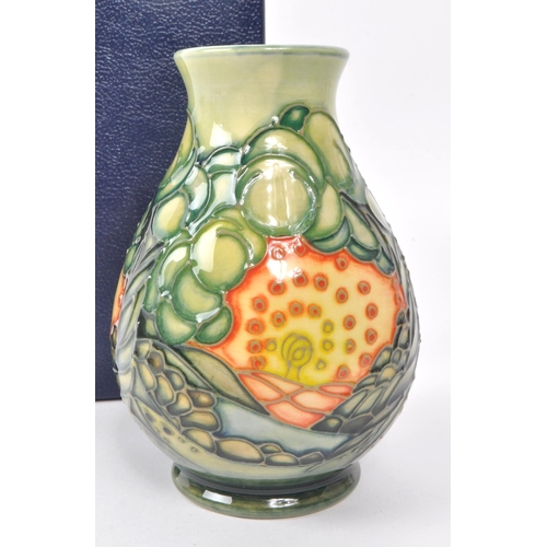 79 - Sally Tuffin for Moorcroft - A squat baluster vase decorated in the 'Seasons (summer)' pattern. With... 