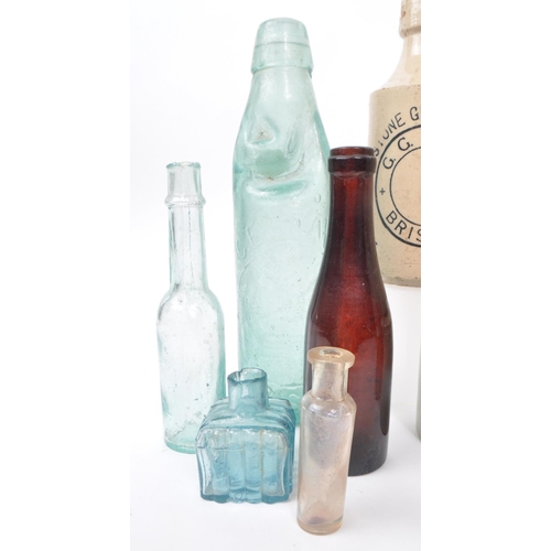 89 - A collection of 19th & 20th century glass and stoneware jugs and bottles. The collection featuri... 