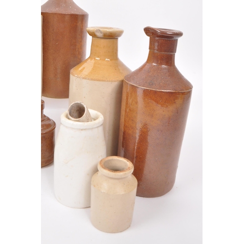 89 - A collection of 19th & 20th century glass and stoneware jugs and bottles. The collection featuri... 