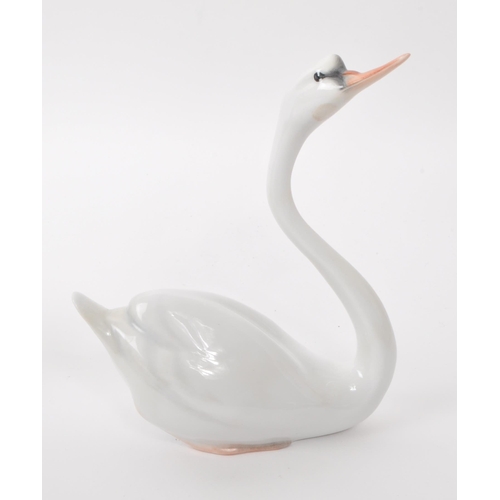 97 - Herend - Two vintage 20th century Herened model 05193000C and 05192000C porcelain mute swan figures.... 