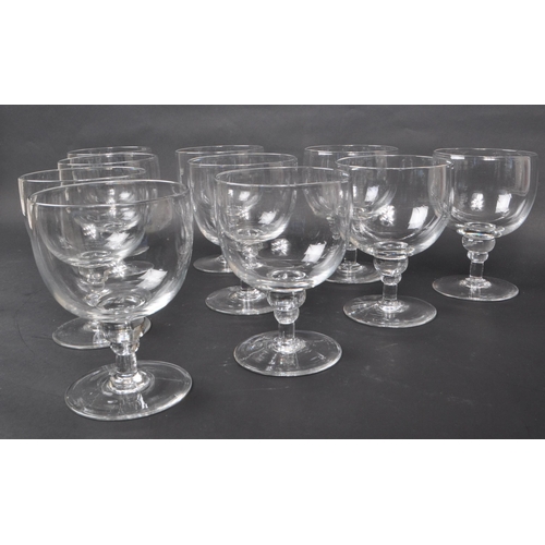 142 - A collection of ten Georgian clear glass / crystal water glasses / goblets. Each features a deep, wi... 