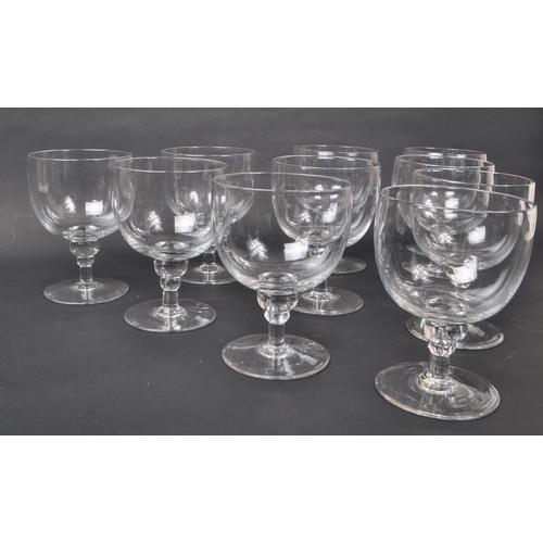 142 - A collection of ten Georgian clear glass / crystal water glasses / goblets. Each features a deep, wi... 