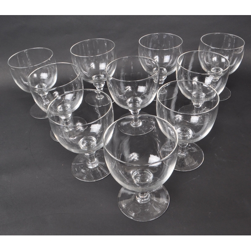 142 - A collection of ten Georgian clear glass / crystal water glasses / goblets. Each features a deep, wi... 