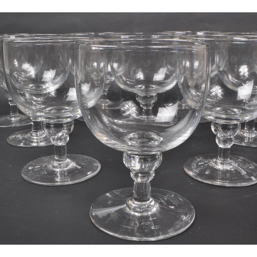 142 - A collection of ten Georgian clear glass / crystal water glasses / goblets. Each features a deep, wi... 