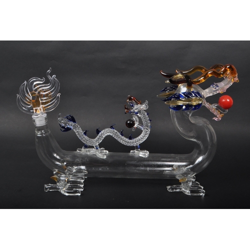 169 - A vintage 20th century murano style Chinese dragon glass decanter. With flame tail stopper, tubular ... 