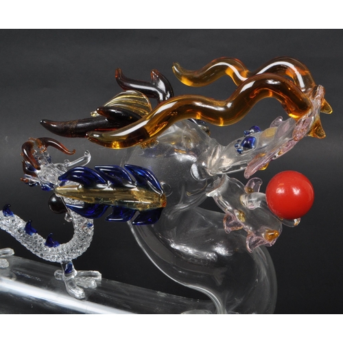 169 - A vintage 20th century murano style Chinese dragon glass decanter. With flame tail stopper, tubular ... 