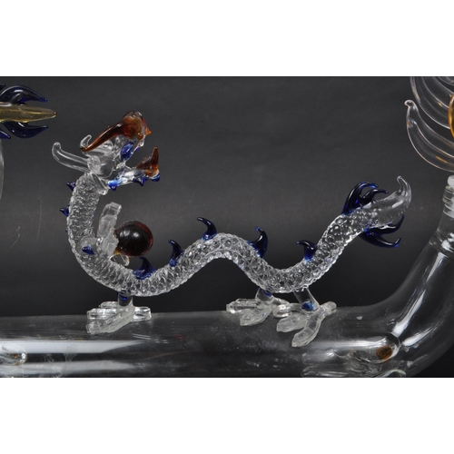 169 - A vintage 20th century murano style Chinese dragon glass decanter. With flame tail stopper, tubular ... 