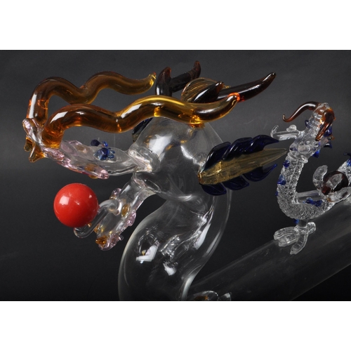 169 - A vintage 20th century murano style Chinese dragon glass decanter. With flame tail stopper, tubular ... 