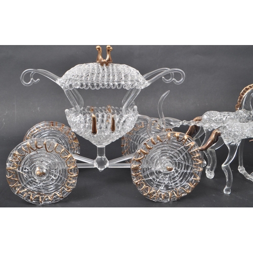 23 - A 20th century studio art glass sculpture of a horse and carriage. The 4-horse drawn carriage with o... 