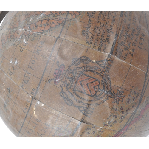 240 - A late 19th century French table top globe. The globe having a carved wooden base, with metal bent a... 