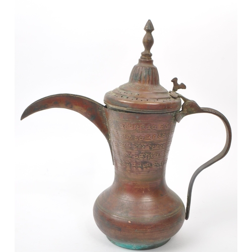 255 - A 19th century Turkish / Islamic dallah - coffee - pot. Fenial top with perforated lid, engraved dec... 