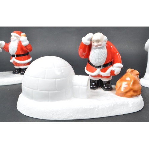 34 - Coalport - Four contemporary early 21st century hand-painted bone china 'The Snowman' figurines, com... 