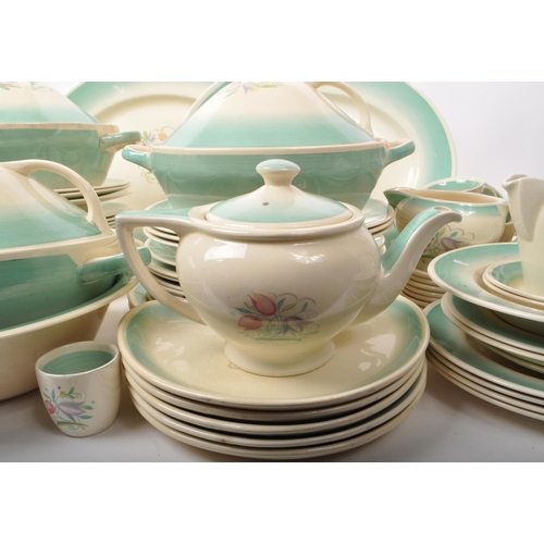 402 - Susie Cooper - A large collection of mid-century ceramic dinner service pieces, with the pattern 'Dr... 