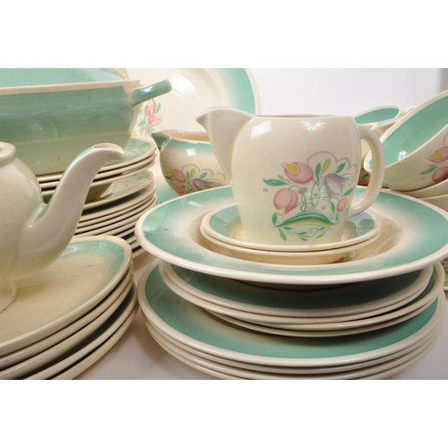 402 - Susie Cooper - A large collection of mid-century ceramic dinner service pieces, with the pattern 'Dr... 