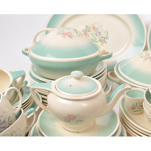 402 - Susie Cooper - A large collection of mid-century ceramic dinner service pieces, with the pattern 'Dr... 