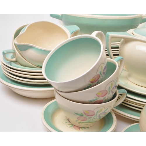 402 - Susie Cooper - A large collection of mid-century ceramic dinner service pieces, with the pattern 'Dr... 