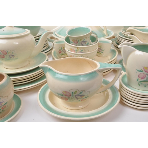 402 - Susie Cooper - A large collection of mid-century ceramic dinner service pieces, with the pattern 'Dr... 