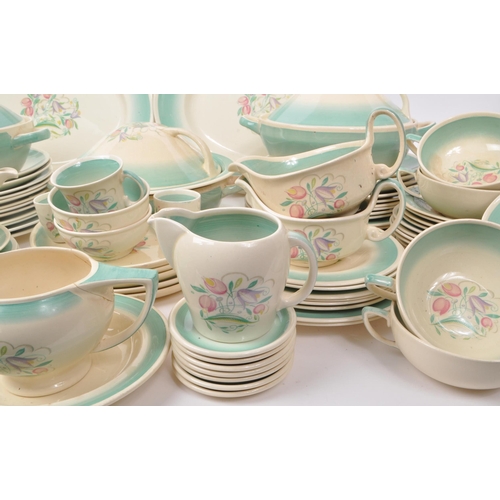 402 - Susie Cooper - A large collection of mid-century ceramic dinner service pieces, with the pattern 'Dr... 