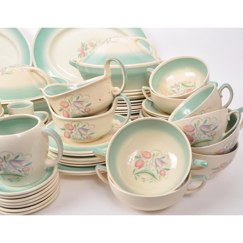 402 - Susie Cooper - A large collection of mid-century ceramic dinner service pieces, with the pattern 'Dr... 