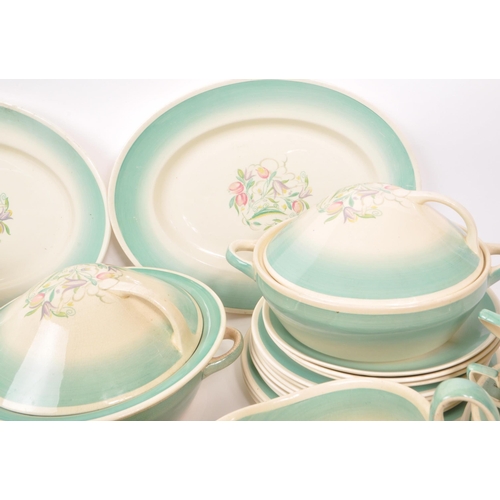 402 - Susie Cooper - A large collection of mid-century ceramic dinner service pieces, with the pattern 'Dr... 