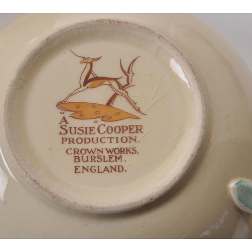 402 - Susie Cooper - A large collection of mid-century ceramic dinner service pieces, with the pattern 'Dr... 