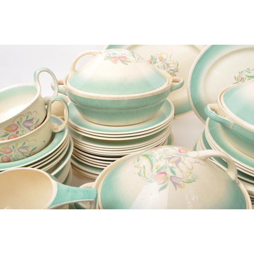 402 - Susie Cooper - A large collection of mid-century ceramic dinner service pieces, with the pattern 'Dr... 