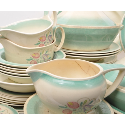 402 - Susie Cooper - A large collection of mid-century ceramic dinner service pieces, with the pattern 'Dr... 