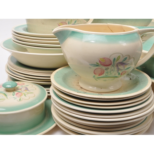 402 - Susie Cooper - A large collection of mid-century ceramic dinner service pieces, with the pattern 'Dr... 