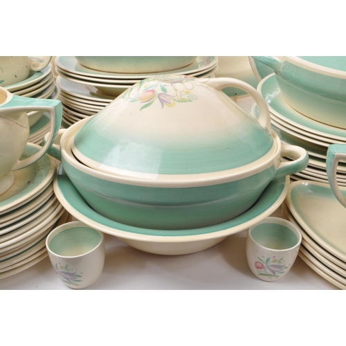 402 - Susie Cooper - A large collection of mid-century ceramic dinner service pieces, with the pattern 'Dr... 