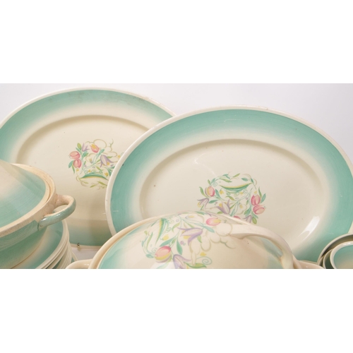 402 - Susie Cooper - A large collection of mid-century ceramic dinner service pieces, with the pattern 'Dr... 