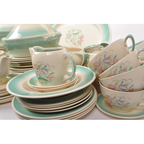 402 - Susie Cooper - A large collection of mid-century ceramic dinner service pieces, with the pattern 'Dr... 