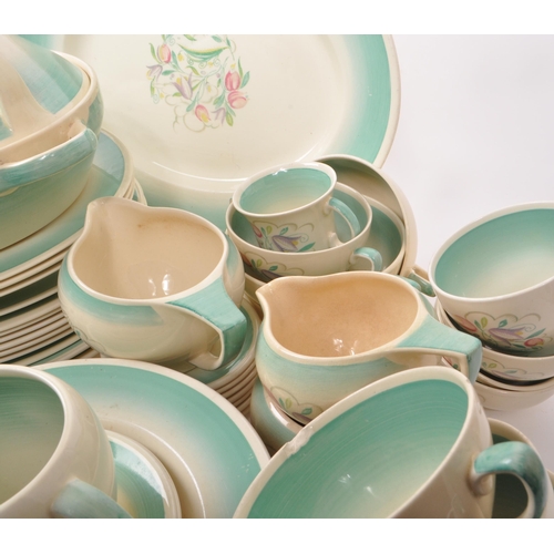 402 - Susie Cooper - A large collection of mid-century ceramic dinner service pieces, with the pattern 'Dr... 