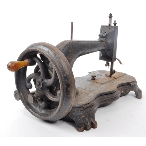 360 - A Victorian 19th century cast iron sewing machine. Turned wooden crank handle, ebonised body with ve... 