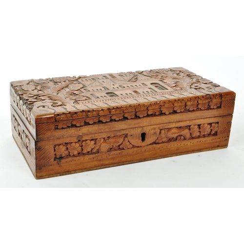 363 - An early 20th century carved Anglo Indian camphor wood jewellery box. With elephant, foliate and arc... 