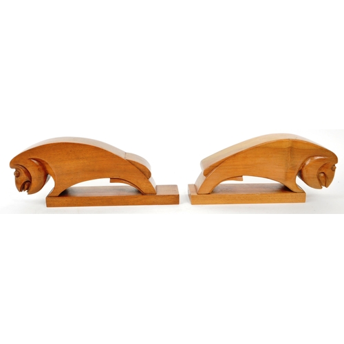 366 - Two vintage mid-century wooden ram-shaped book ends. Burned 'Clark' to the underside of each figure.... 