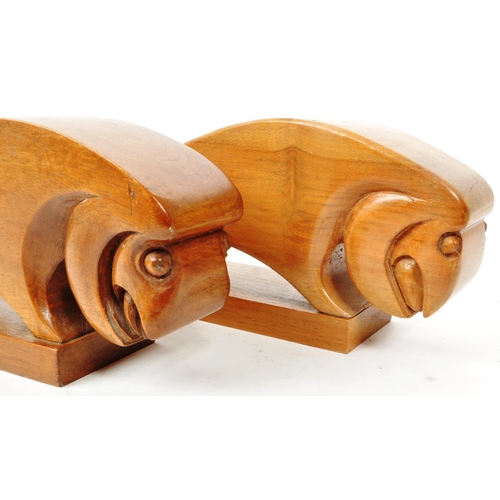 366 - Two vintage mid-century wooden ram-shaped book ends. Burned 'Clark' to the underside of each figure.... 