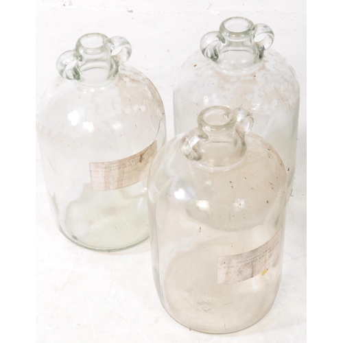 126 - A collection of six vintage 1980s Demijohn glass brewing bottles. Some with labels dating 'October 1... 