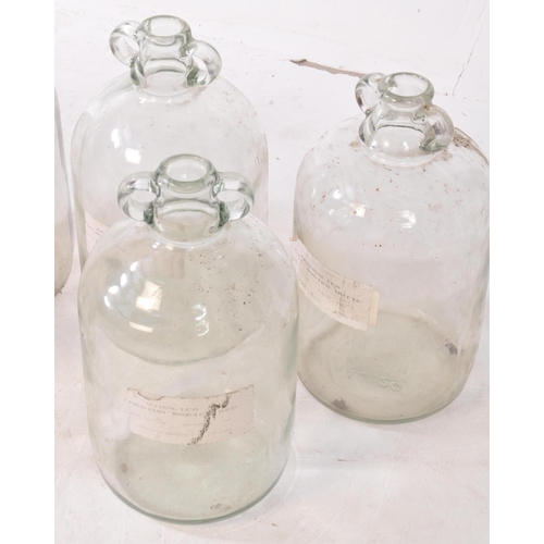 126 - A collection of six vintage 1980s Demijohn glass brewing bottles. Some with labels dating 'October 1... 