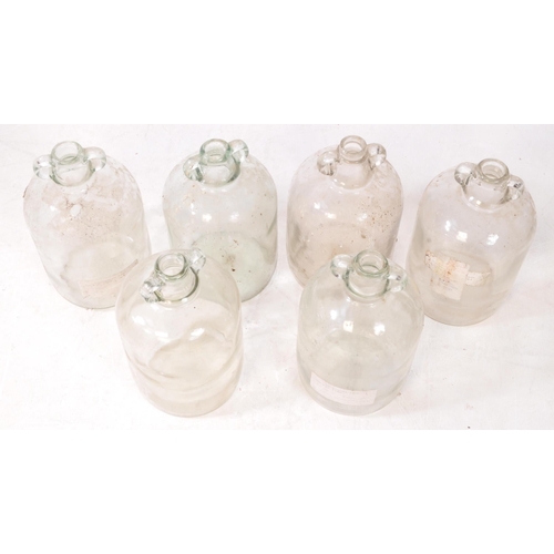 128 - A collection of six vintage 1980s Demijohn glass brewing bottles. Some with labels dating 'September... 