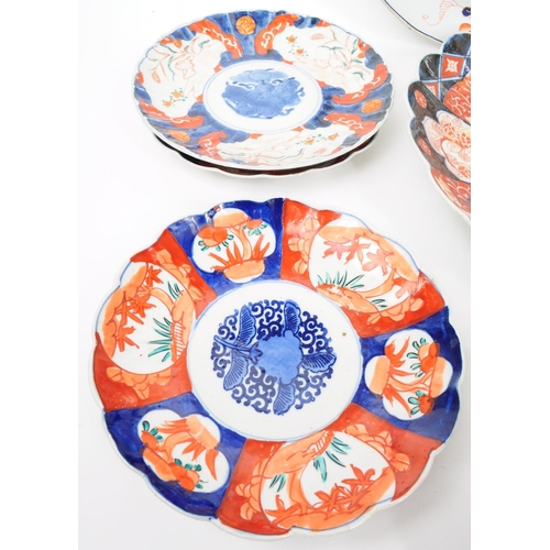 155 - A collection of late 19th century Imari style patterend dish plates and large serving platter. Featu... 