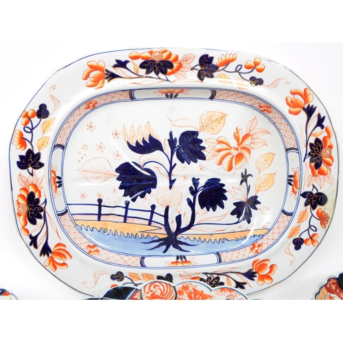 155 - A collection of late 19th century Imari style patterend dish plates and large serving platter. Featu... 