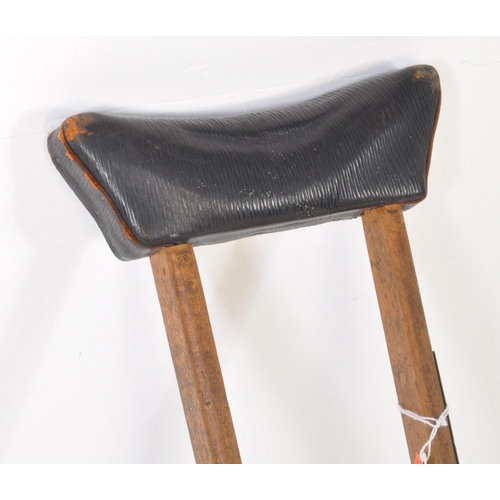 283 - An early 20th-century vintage Bristol, Cossham Memorial Hospital crutch. It features a leather armpi... 